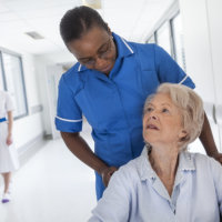 caretaker smile at elderly man