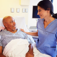 caretaker talking to her patient