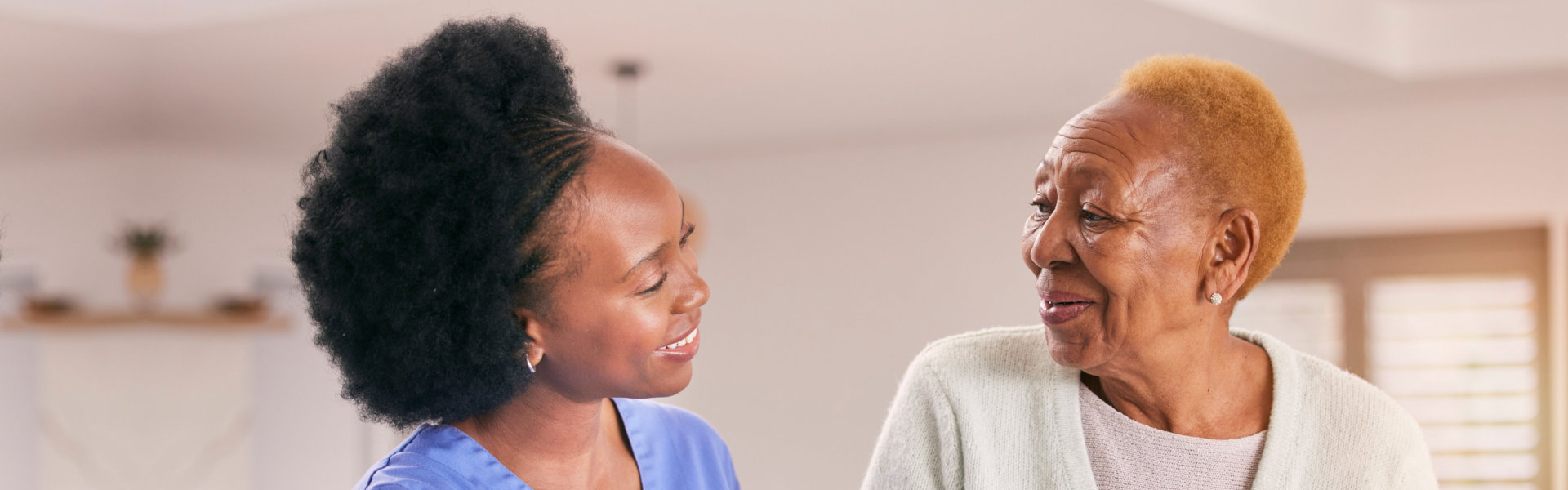 caretaker and elderly woman talking