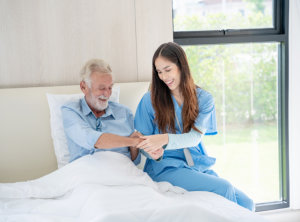 Medical staff taking and caregiver senior man in Home