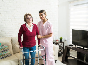 Nurse Supporting Senior Patient At Home